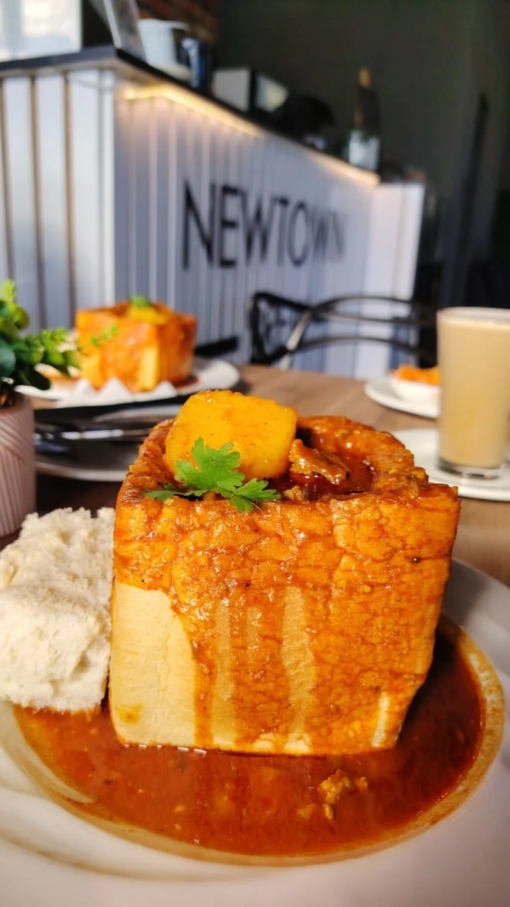 Bunny chow with sides at NewTown Brew